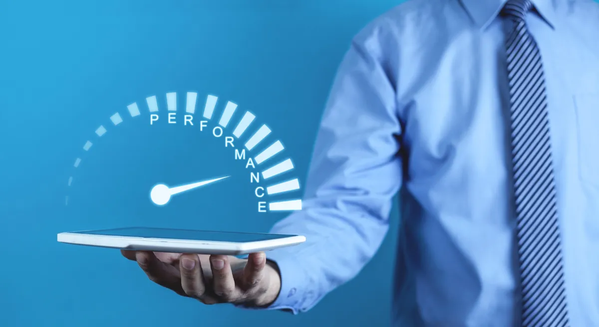 Hand holding a performance gauge on a tablet