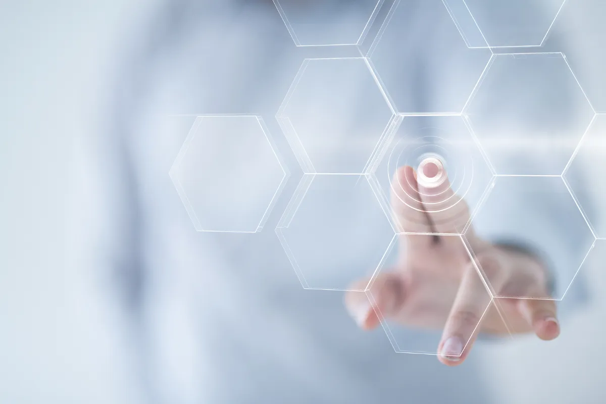 Hand touching a hexagon interface